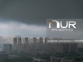 The city of Lianyungang is being covered by dark clouds in Lianyungang, China, on July 7, 2024. (