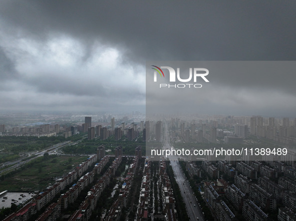 The city of Lianyungang is being covered by dark clouds in Lianyungang, China, on July 7, 2024. 