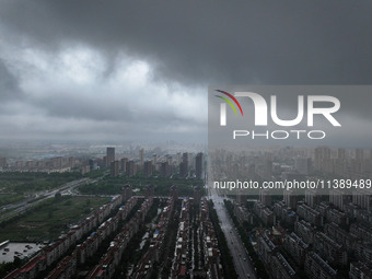 The city of Lianyungang is being covered by dark clouds in Lianyungang, China, on July 7, 2024. (