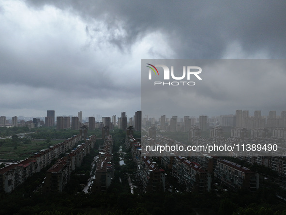 The city of Lianyungang is being covered by dark clouds in Lianyungang, China, on July 7, 2024. 