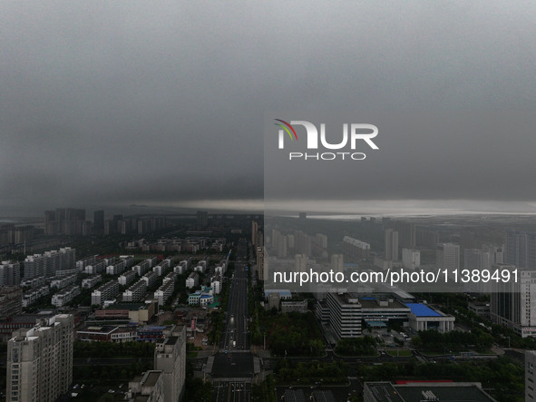 The city of Lianyungang is being covered by dark clouds in Lianyungang, China, on July 7, 2024. 