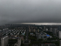 The city of Lianyungang is being covered by dark clouds in Lianyungang, China, on July 7, 2024. (