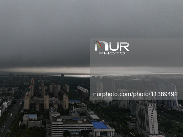 The city of Lianyungang is being covered by dark clouds in Lianyungang, China, on July 7, 2024. 