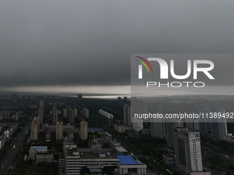 The city of Lianyungang is being covered by dark clouds in Lianyungang, China, on July 7, 2024. (