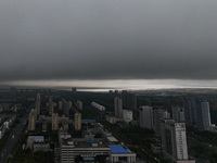 The city of Lianyungang is being covered by dark clouds in Lianyungang, China, on July 7, 2024. (