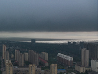 The city of Lianyungang is being covered by dark clouds in Lianyungang, China, on July 7, 2024. (