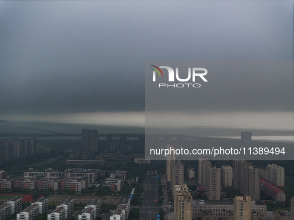 The city of Lianyungang is being covered by dark clouds in Lianyungang, China, on July 7, 2024. 