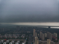 The city of Lianyungang is being covered by dark clouds in Lianyungang, China, on July 7, 2024. (