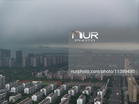 The city of Lianyungang is being covered by dark clouds in Lianyungang, China, on July 7, 2024. 