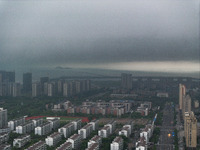 The city of Lianyungang is being covered by dark clouds in Lianyungang, China, on July 7, 2024. (