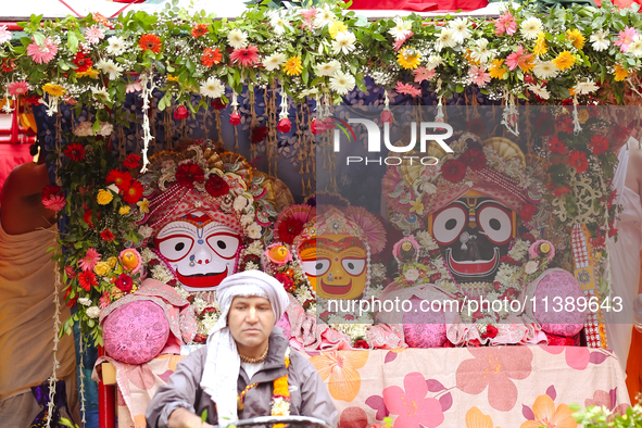 Members of ISKON are taking part in the Jagannath Chariot procession in Kathmandu, Nepal, on July 7, 2024. 