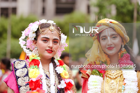 Nepali devotees are decorating as Lord Krishna and Radha and participating in the chariot of Lord Jagannath procession in Kathmandu, Nepal,...