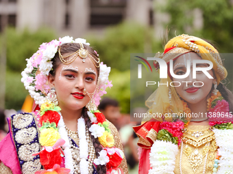 Nepali devotees are decorating as Lord Krishna and Radha and participating in the chariot of Lord Jagannath procession in Kathmandu, Nepal,...