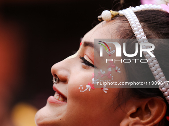 A Nepali devout is performing a dance ahead of the Lord Jagannath chariot that is rolling out on the street of Kathmandu, Nepal, on July 7,...