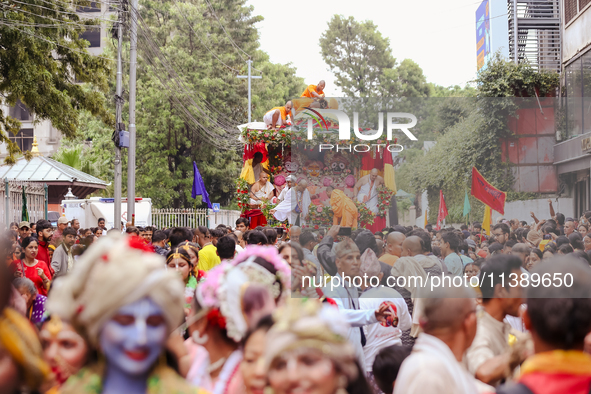 Members of ISKON are taking part in the Jagannath Chariot procession in Kathmandu, Nepal, on July 7, 2024. 