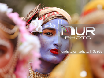 Nepali devotees are decorating as Lord Krishna and participating in the chariot of Lord Jagannath procession in Kathmandu, Nepal, on July 7,...