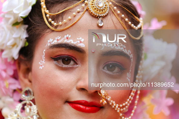 Nepali devotees are decorating as Radha and participating in the chariot of Lord Jagannath procession in Kathmandu, Nepal, on July 7, 2024. 