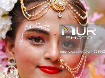 Nepali devotees are decorating as Radha and participating in the chariot of Lord Jagannath procession in Kathmandu, Nepal, on July 7, 2024....