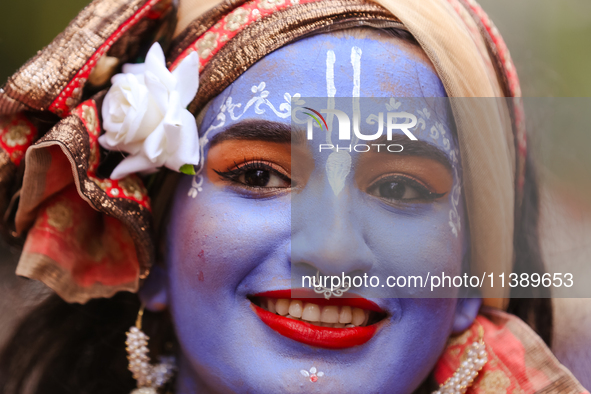 Nepali devotees are decorating as Lord Krishna and participating in the chariot of Lord Jagannath procession in Kathmandu, Nepal, on July 7,...