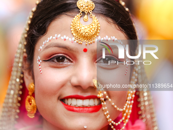 Nepali devotees are decorating as Radha and participating in the chariot of Lord Jagannath procession in Kathmandu, Nepal, on July 7, 2024....