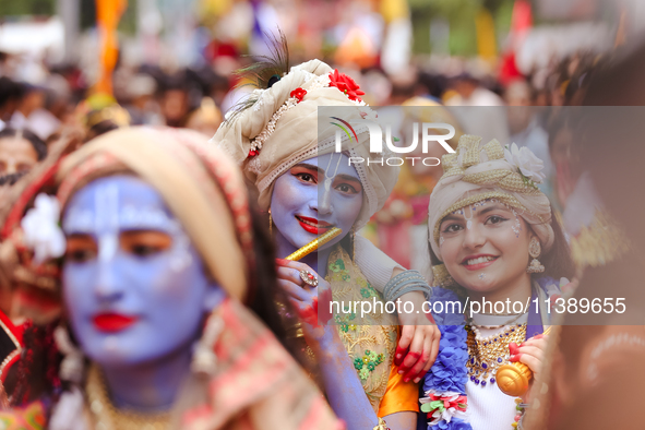 Nepali devotees are decorating as Lord Krishna and Radha and participating in the chariot of Lord Jagannath procession in Kathmandu, Nepal,...