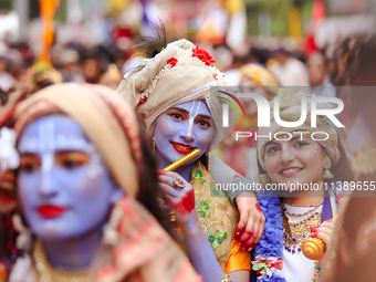 Nepali devotees are decorating as Lord Krishna and Radha and participating in the chariot of Lord Jagannath procession in Kathmandu, Nepal,...