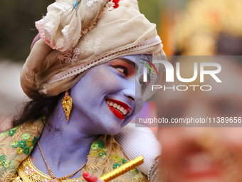 Nepali devotees are decorating as Lord Krishna and participating in the chariot of Lord Jagannath procession in Kathmandu, Nepal, on July 7,...