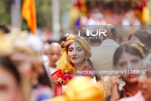 Nepali devotees are decorating as Lord Krishna and participating in the chariot of Lord Jagannath procession in Kathmandu, Nepal, on July 7,...