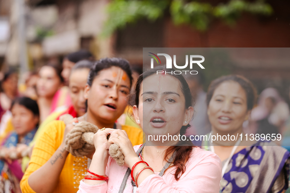 Devotees are pulling the chariot of Lord Jagannath during the Jagannath Rath Yatra procession in Kathmandu, Nepal, on July 7, 2024. 