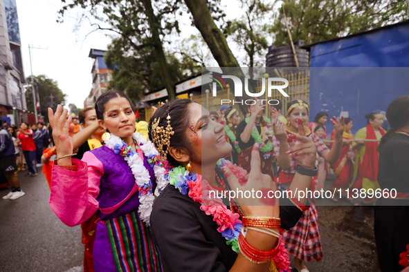 A Nepali devout is performing a dance ahead of the Lord Jagannath chariot that is rolling out on the street of Kathmandu, Nepal, on July 7,...