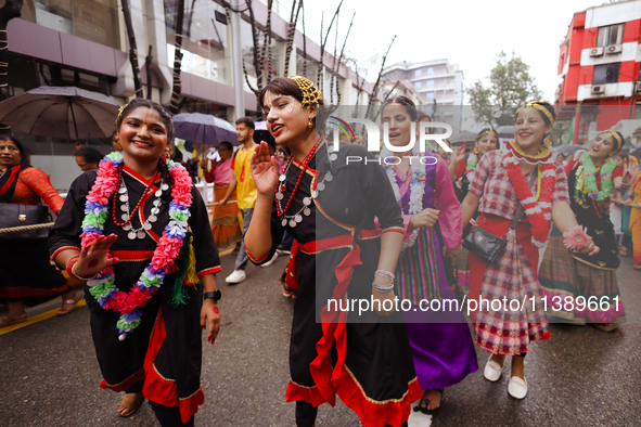 A Nepali devout is performing a dance ahead of the Lord Jagannath chariot that is rolling out on the street of Kathmandu, Nepal, on July 7,...