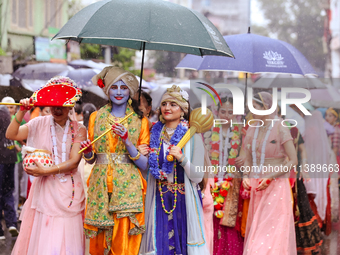 Nepali devotees are decorating as Lord Krishna and Radha and participating in the chariot of Lord Jagannath procession in Kathmandu, Nepal,...