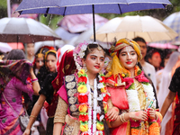 Nepali devotees are decorating as Lord Krishna and Radha and participating in the chariot of Lord Jagannath procession in Kathmandu, Nepal,...