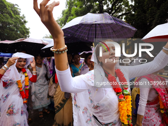 A Nepali devout is performing a dance ahead of the Lord Jagannath chariot that is rolling out on the street of Kathmandu, Nepal, on July 7,...