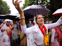 A Nepali devout is performing a dance ahead of the Lord Jagannath chariot that is rolling out on the street of Kathmandu, Nepal, on July 7,...