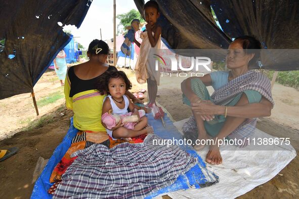 Flood-affected villagers are staying at a relief camp during the flood near Patiapum village in Nagaon District of Assam, India, on July 7,...