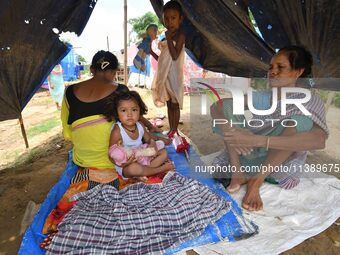 Flood-affected villagers are staying at a relief camp during the flood near Patiapum village in Nagaon District of Assam, India, on July 7,...