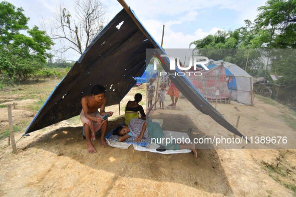 Flood-affected villagers are staying at a relief camp during the flood near Patiapum village in Nagaon District of Assam, India, on July 7,...