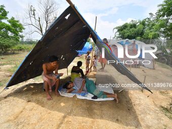 Flood-affected villagers are staying at a relief camp during the flood near Patiapum village in Nagaon District of Assam, India, on July 7,...