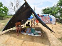 Flood-affected villagers are staying at a relief camp during the flood near Patiapum village in Nagaon District of Assam, India, on July 7,...