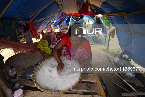 Flood-affected villagers are staying at a relief camp during the flood near Patiapum village in Nagaon District of Assam, India, on July 7,...