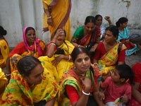 A woman is drinking water on a hot summer day in Kolkata, India, on July 7, 2024. (