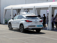 A driverless taxi is appearing at the 2024 WAIC in Shanghai, China, on July 7, 2024. (