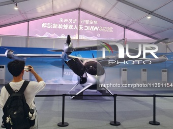 An eVTOL, a low-altitude electric vertical take-off and landing vehicle produced by AUTOFLIGHT, is being displayed at the 2024 WAIC in Shang...