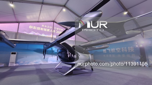 An eVTOL, a low-altitude electric vertical take-off and landing vehicle produced by AUTOFLIGHT, is being displayed at the 2024 WAIC in Shang...