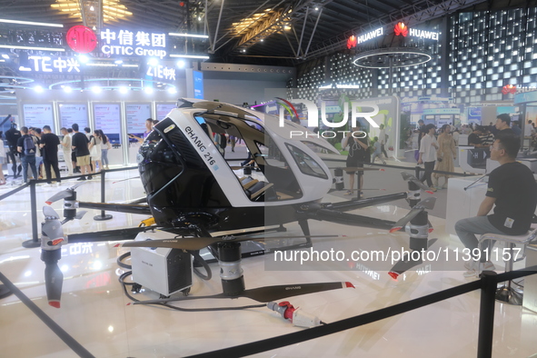 An eVTOL, a low-altitude electric vertical take-off and landing vehicle produced by CITIC Group, is on display at the 2024 WAIC in Shanghai,...