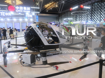 An eVTOL, a low-altitude electric vertical take-off and landing vehicle produced by CITIC Group, is on display at the 2024 WAIC in Shanghai,...