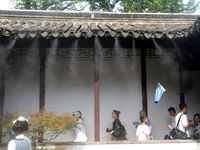 Visitors are playing in a lingering garden installed with spray in Suzhou, Jiangsu province, China, on July 8, 2024. In the hot summer, the...