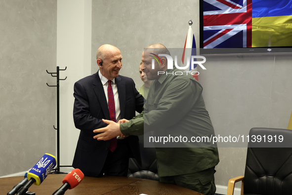 John Healey, Secretary of State for the Defence of the UK, and Rustem Umerov, Minister of Defence of Ukraine, are shaking hands before a joi...