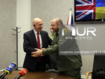 John Healey, Secretary of State for the Defence of the UK, and Rustem Umerov, Minister of Defence of Ukraine, are shaking hands before a joi...